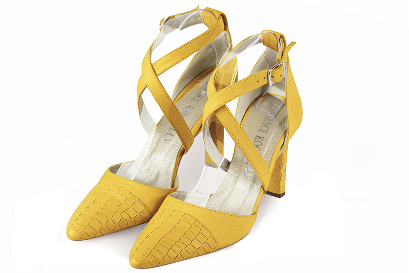 Yellow women's open side shoes, with crossed straps. Tapered toe. High slim heel. Front view - Florence KOOIJMAN